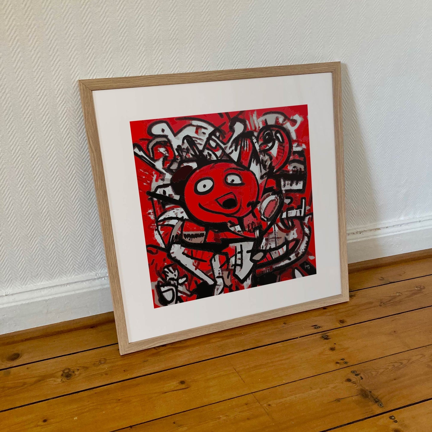 Œuvre "DINGO" encadrée en 50x50cm, personnage déjanté en rouge, noir et blanc, cadre en bois clair, style art urbain abstrait audacieux, 2024