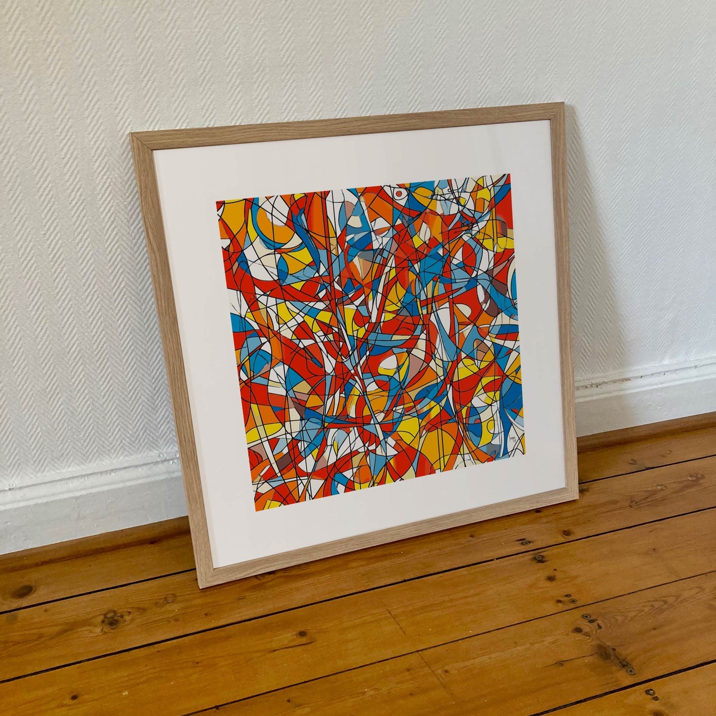 Œuvre 'AGITATION' encadrée en 50x50cm, lignes noires et couleurs rouge, bleu, jaune, orange, cadre en bois clair, art contemporain expressif, 2024