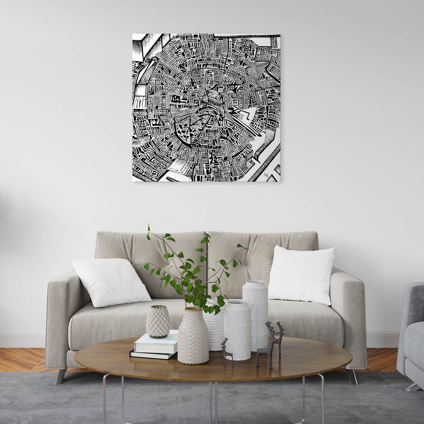 Mise en situation de l’œuvre "Matrice" dans un intérieur contemporain, affichée sur un mur blanc, mettant en valeur son style graphique noir et blanc sophistiqué.
