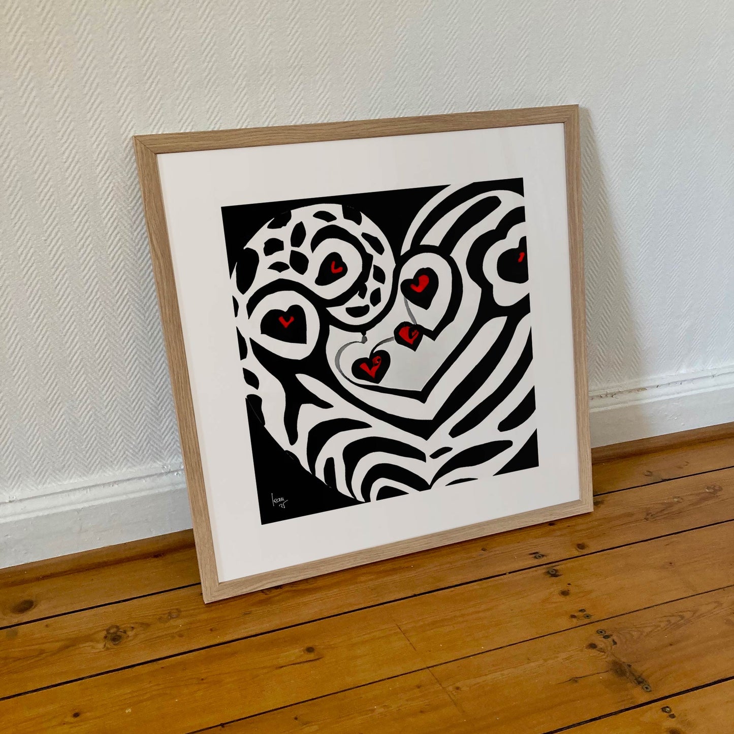 Tirage encadré 50x50 cm de 'Battement', représentation artistique d’un cœur graphique en format carré.