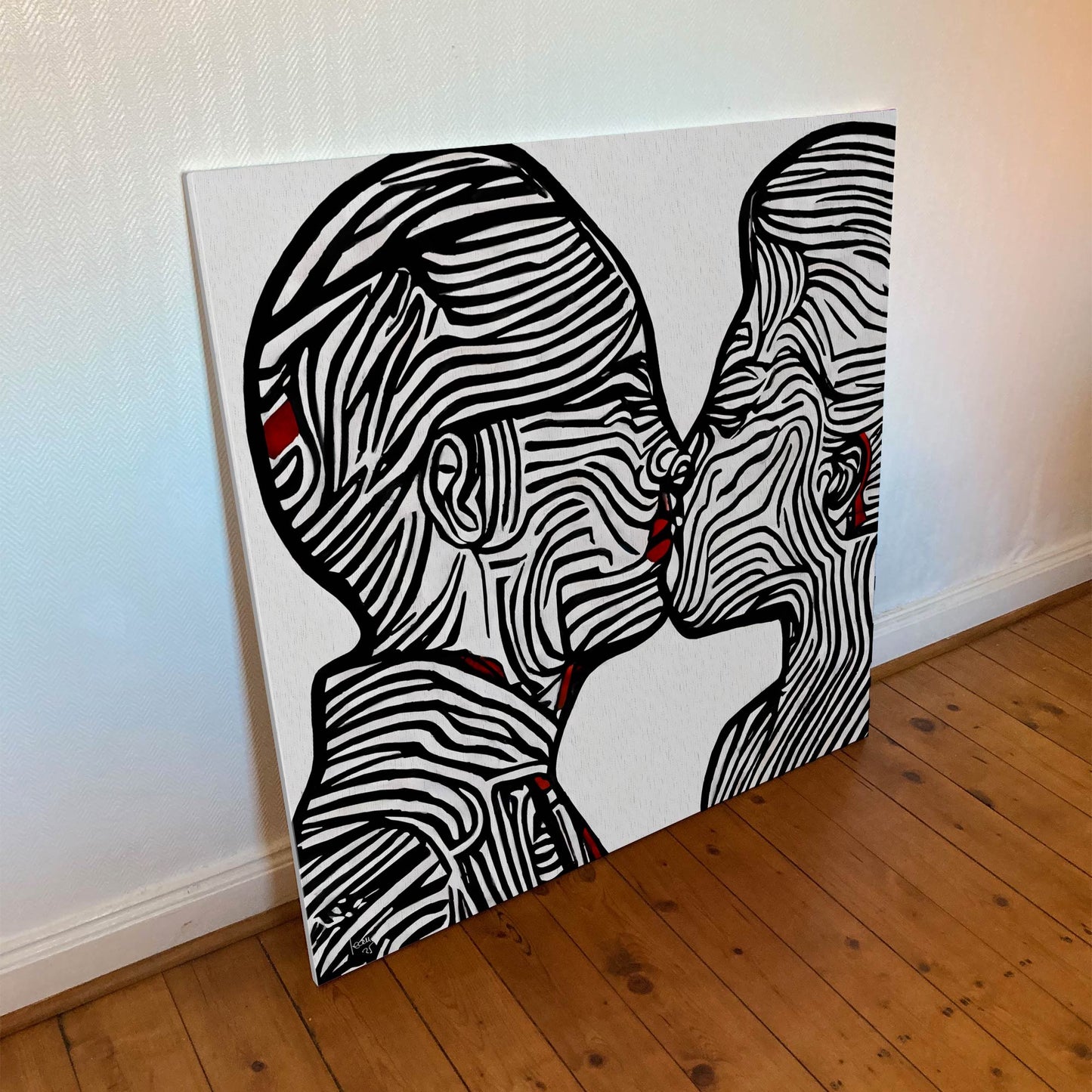 "Ondes" montrant les lignes graphiques ondulées en noir, blanc et rouge.