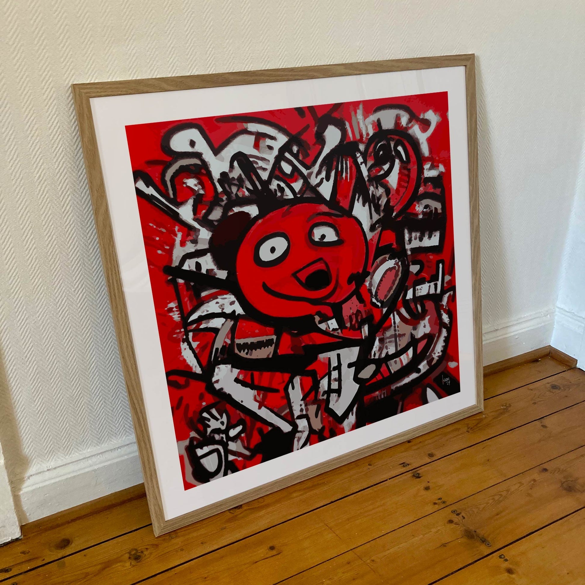 Œuvre "DINGO" encadrée en 70x70cm, personnage au sourire rebelle en rouge, noir et blanc, cadre en bois clair avec verre acrylique, art urbain vibrant, 2024