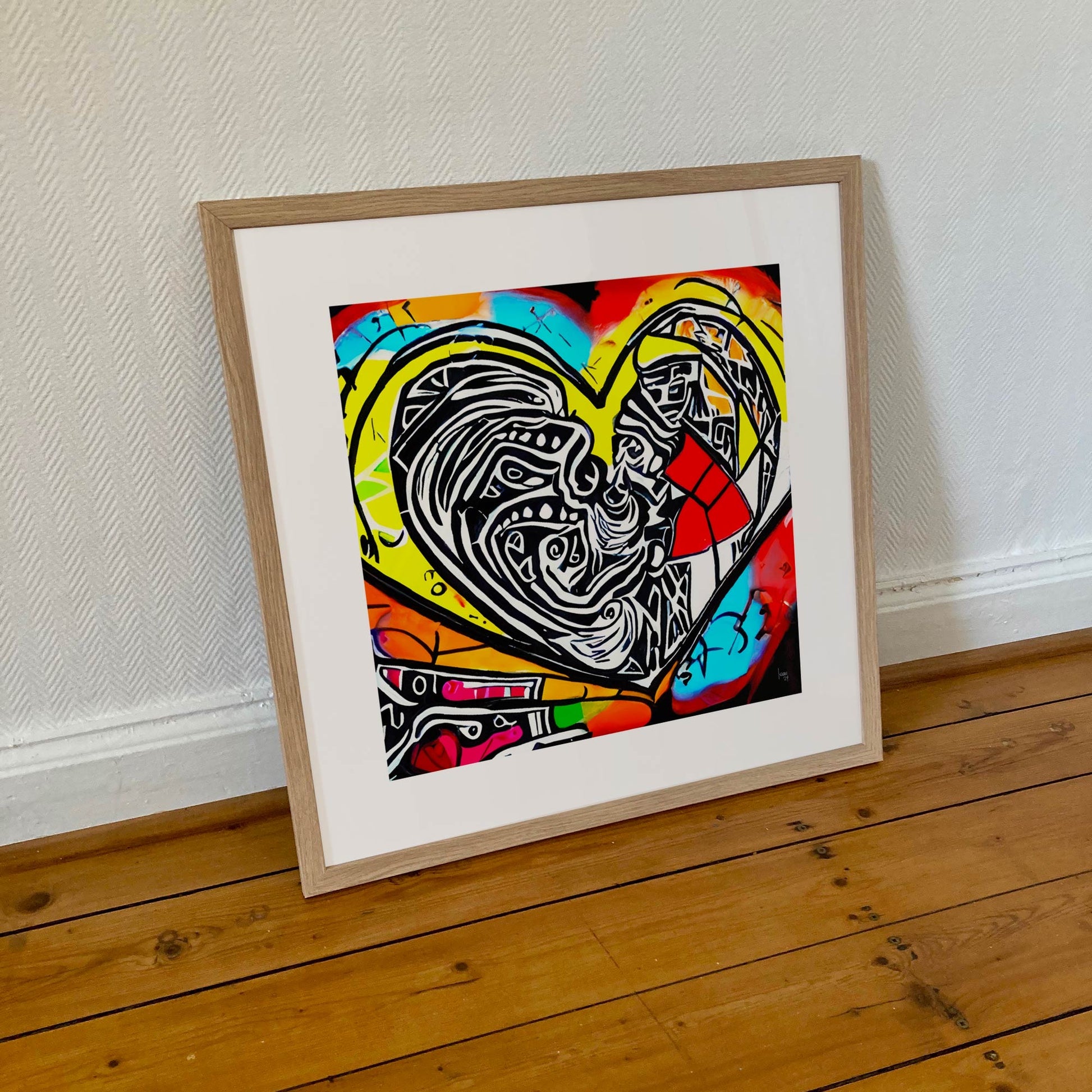 Œuvre 'Espoir' encadrée format 50×50 cm, cœur intense en explosion de noir, blanc, rouge, jaune, bleu et orange