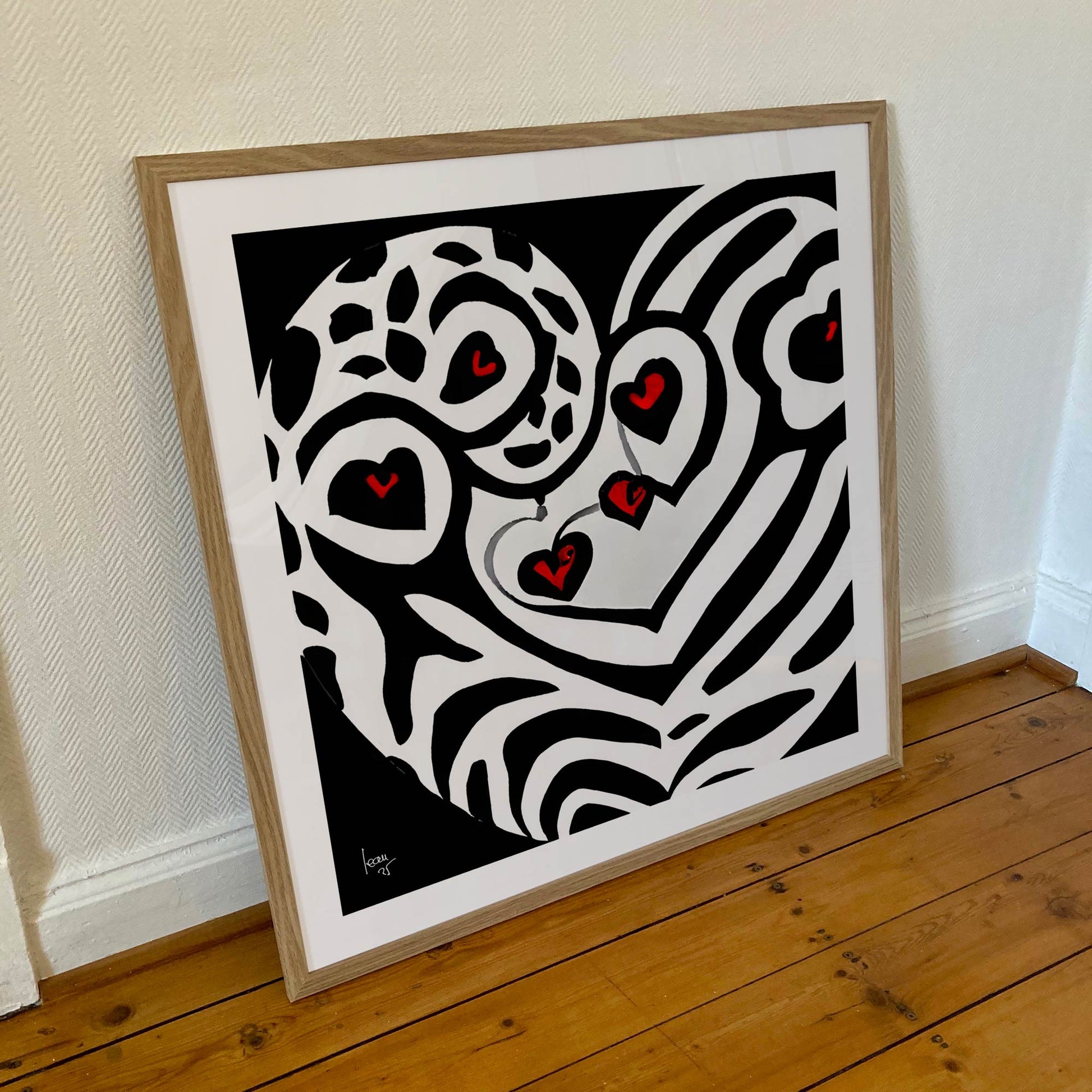 Œuvre encadrée 'Battement' au format 70x70 cm, cœur vibrant et stylisé dans une composition contemporaine.