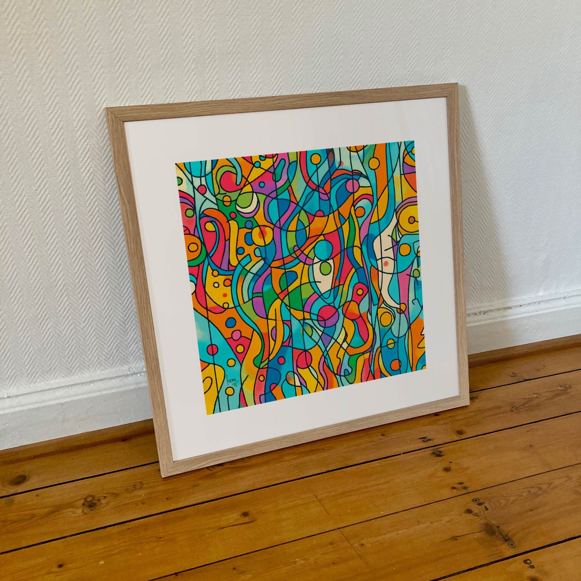 Tirage encadré 50×50 cm de 'Capsules', œuvre abstraite colorée aux formes rondes et dynamiques, présentée dans un cadre moderne sobre.