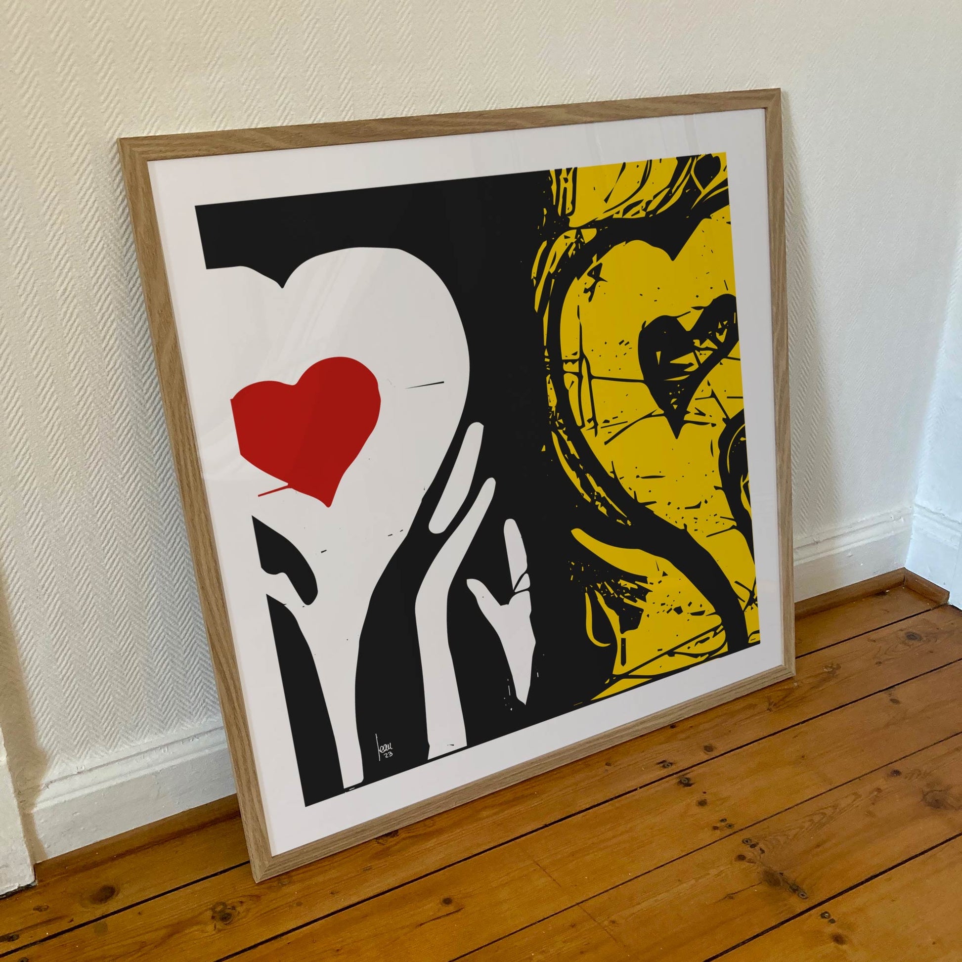 "Hésitations" tirage d'art sous cadre 70x70cm  tirage haut de gamme. Deux coeurs côte à côte jaune, noir et rouge. Art contemporain abstrait et achat en ligne